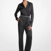 Jumpsuit med långa ärmar i satin och skärp