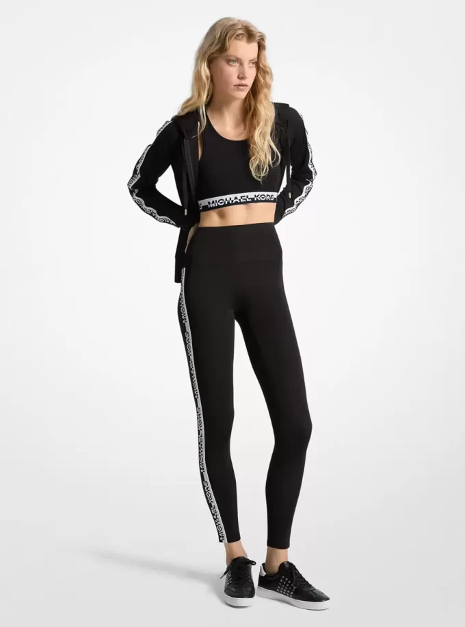 Stretchiga stickade leggings med hög midja och logotyptejp Stretchiga stickade leggings med hög midja och logotyptejp